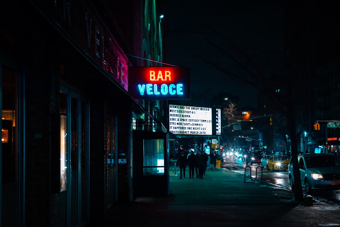 people near bar veloce sign