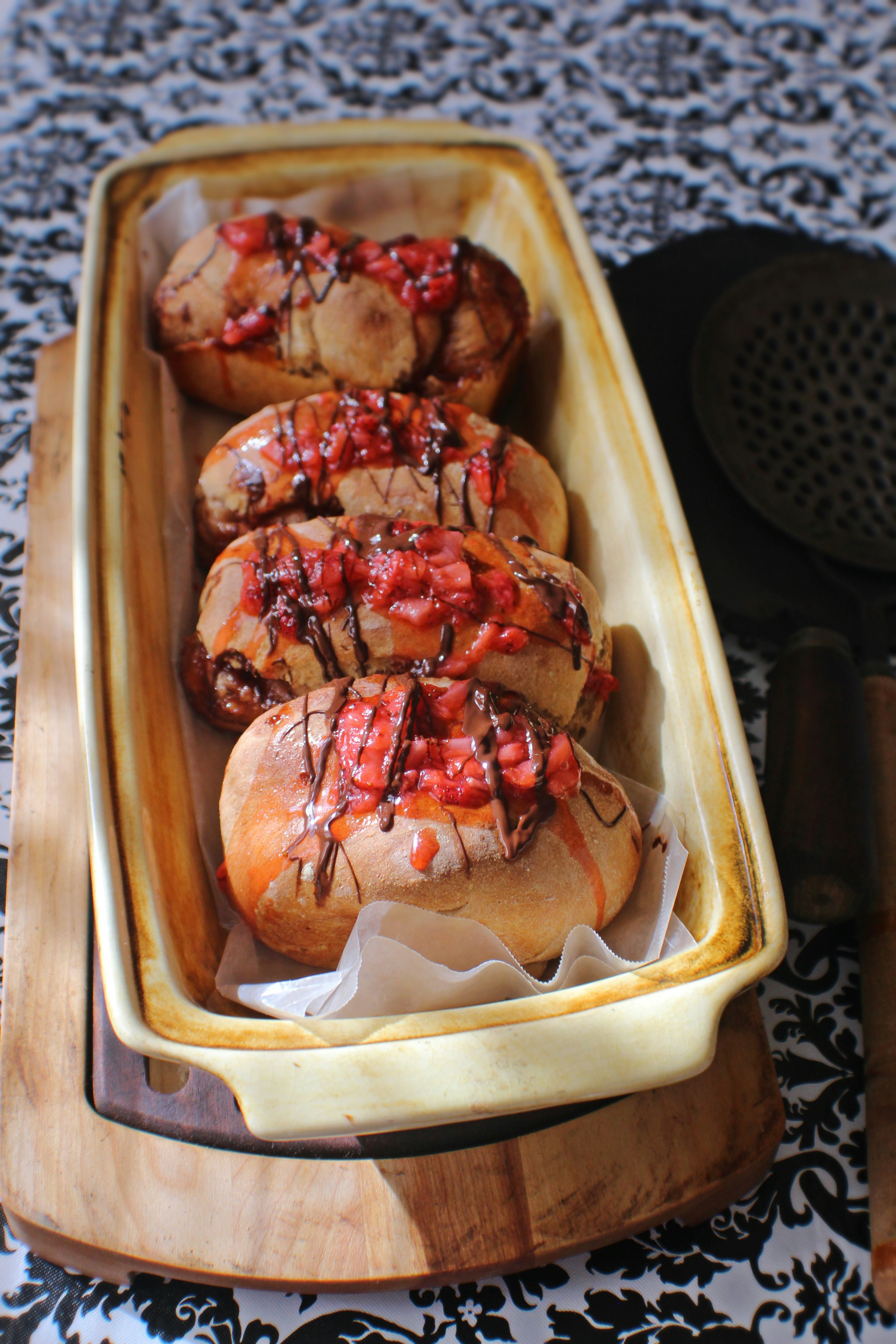 four breads with toppings in tray