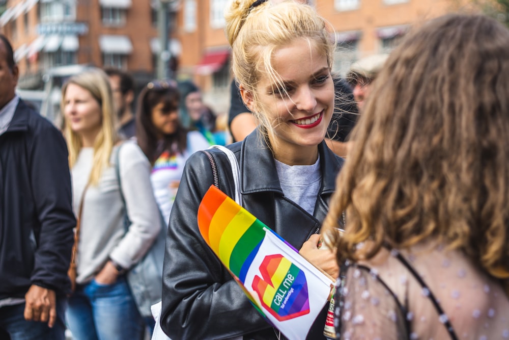 woman smiling wearing black leather jacket