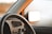 Close-up of a clean car dashboard with sunlight reflecting off the surfaces.