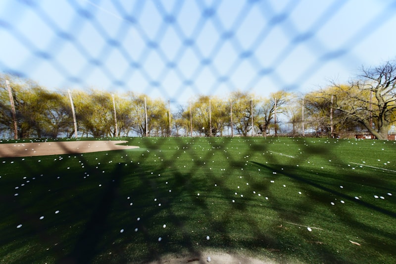 Golfer hitting shots at a driving range with Toptracer