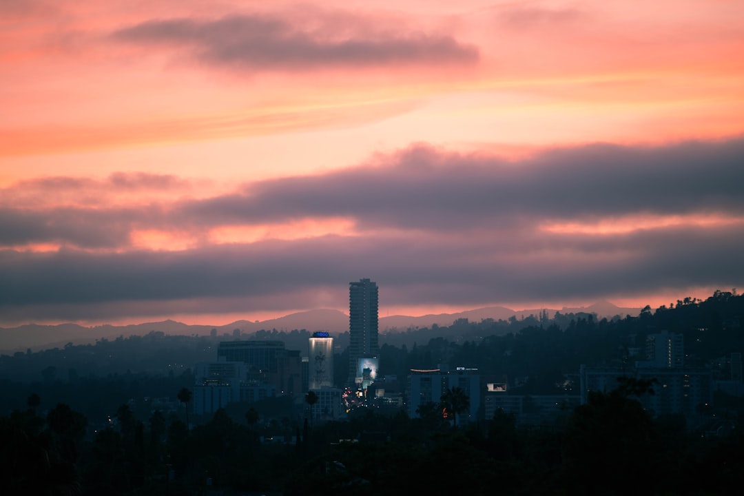 top view of cityscape under cloudy sky