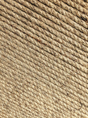 Close-up of durable plastic ropes coiled and ready for shipment.