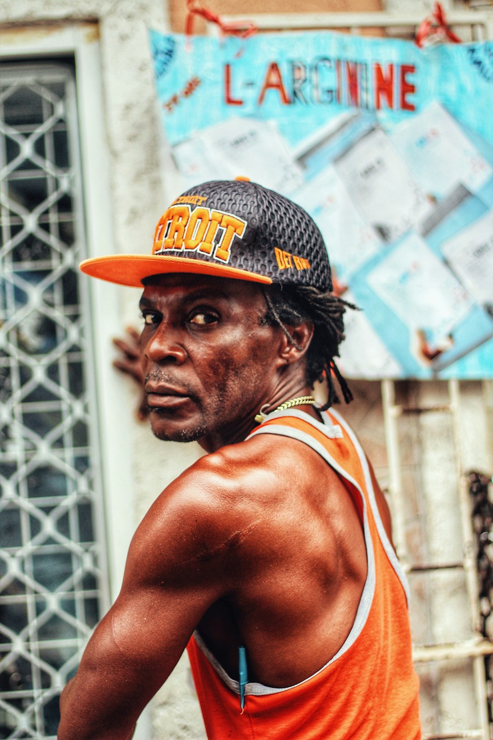 man looking at his left near building