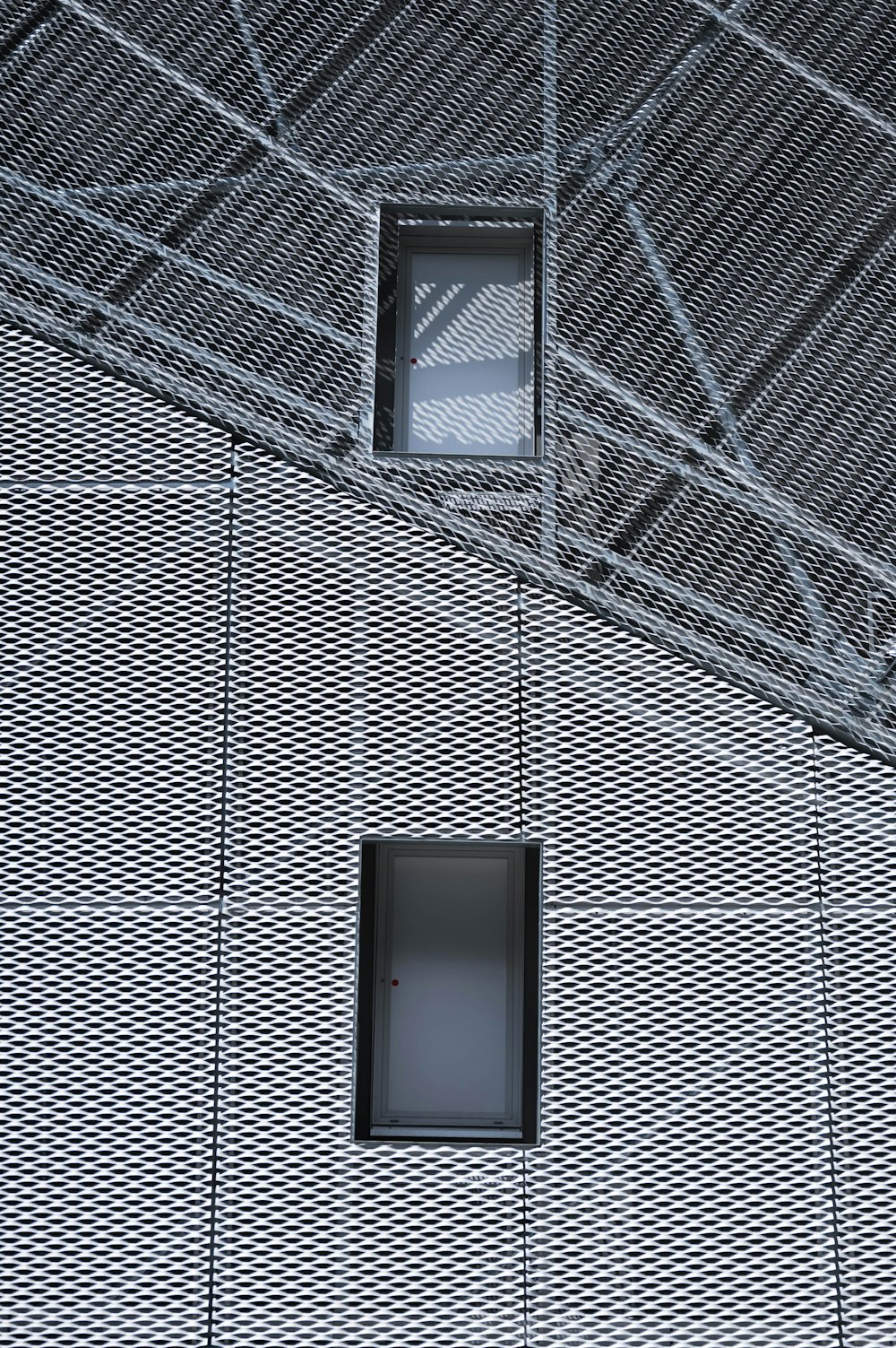 a window in a building with a metal roof