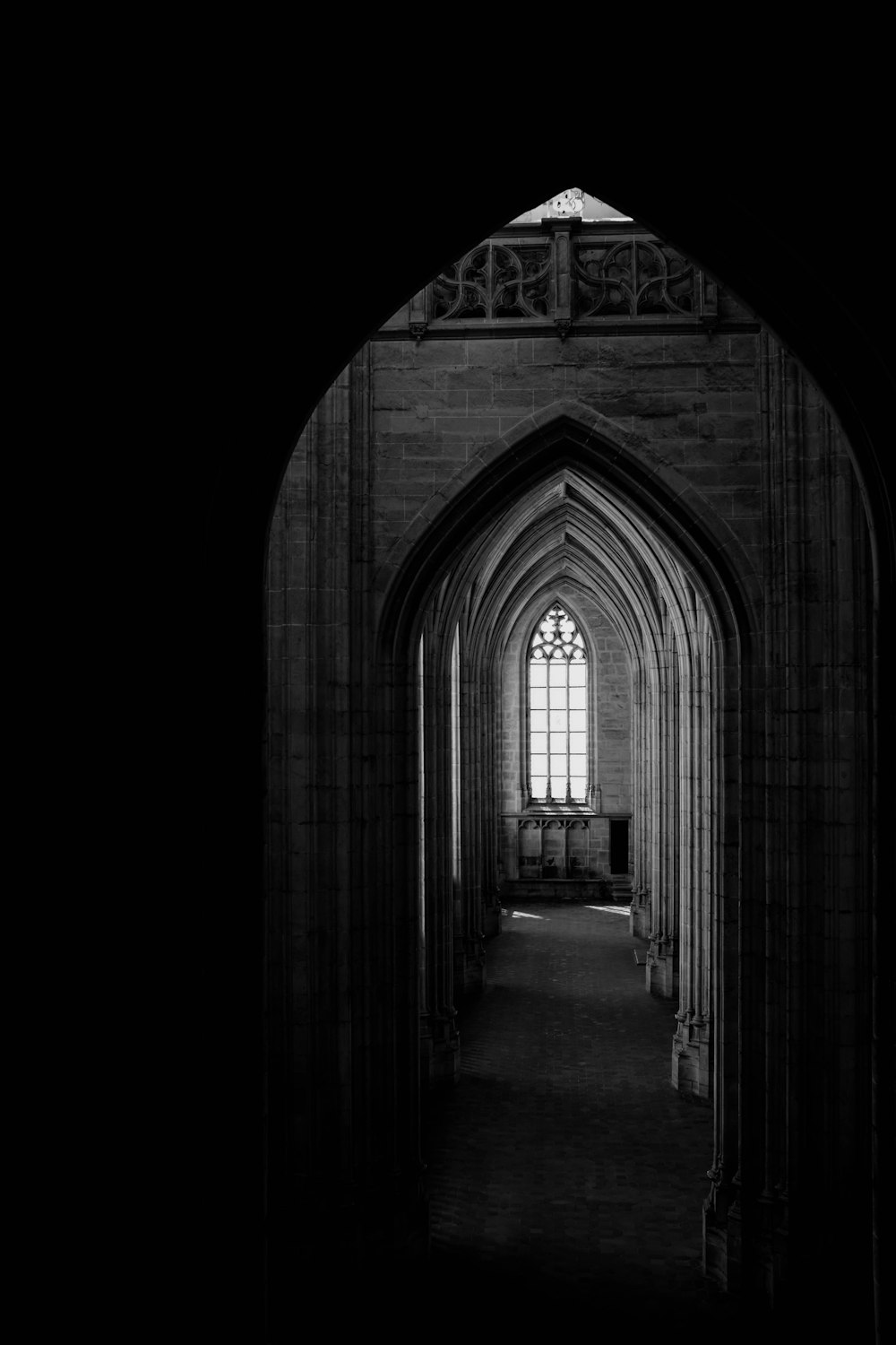 a black and white photo of an arched doorway
