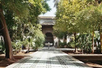 A serene garden path leading to a welcoming entrance of a nursing home.
