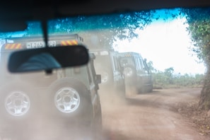 A group riding RZR vehicles through a lush forest trail in Valle de Bravo.