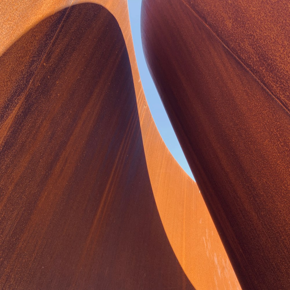 a very tall sand dune with a sky in the background