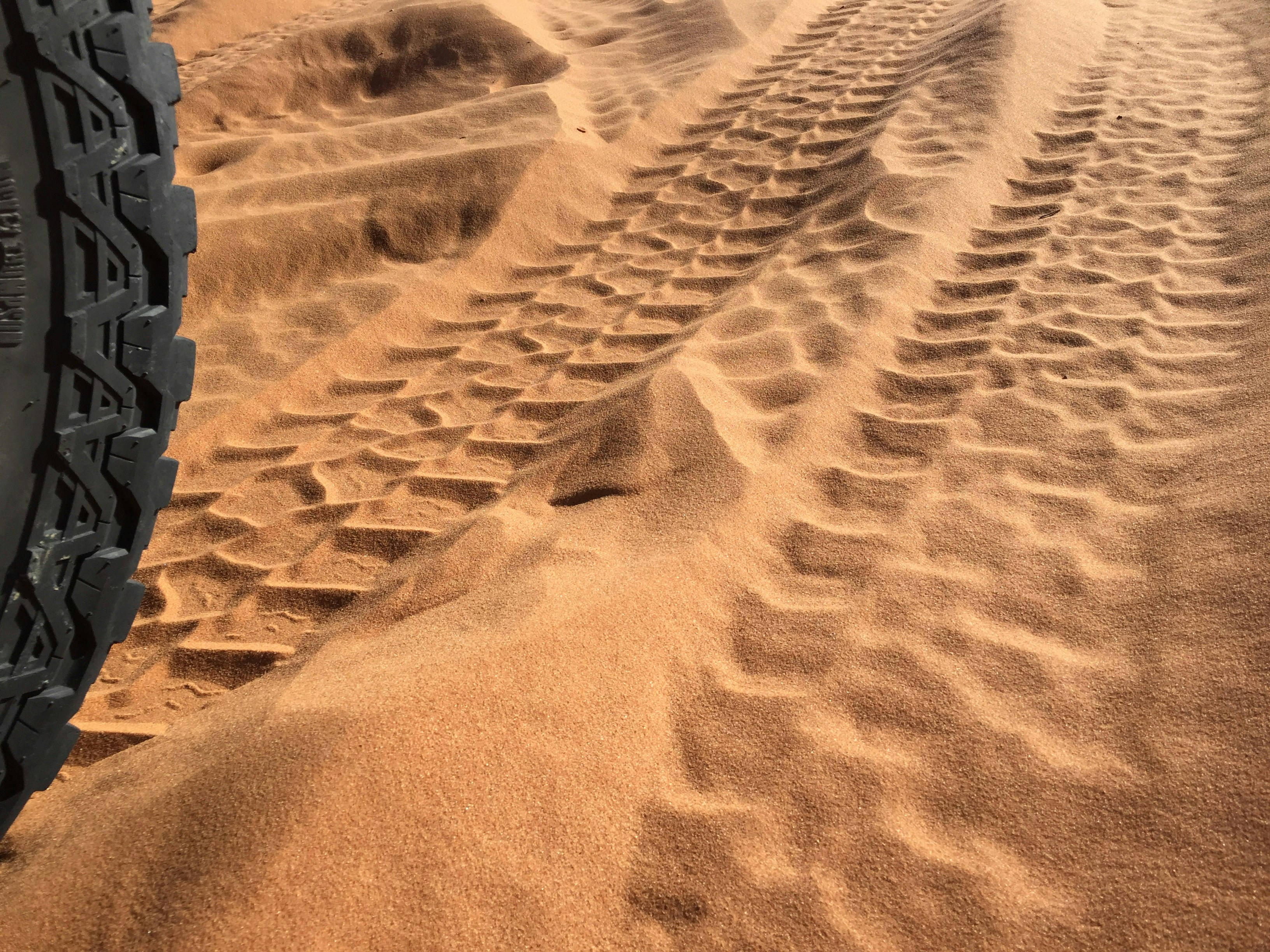 tire on dessert sand
