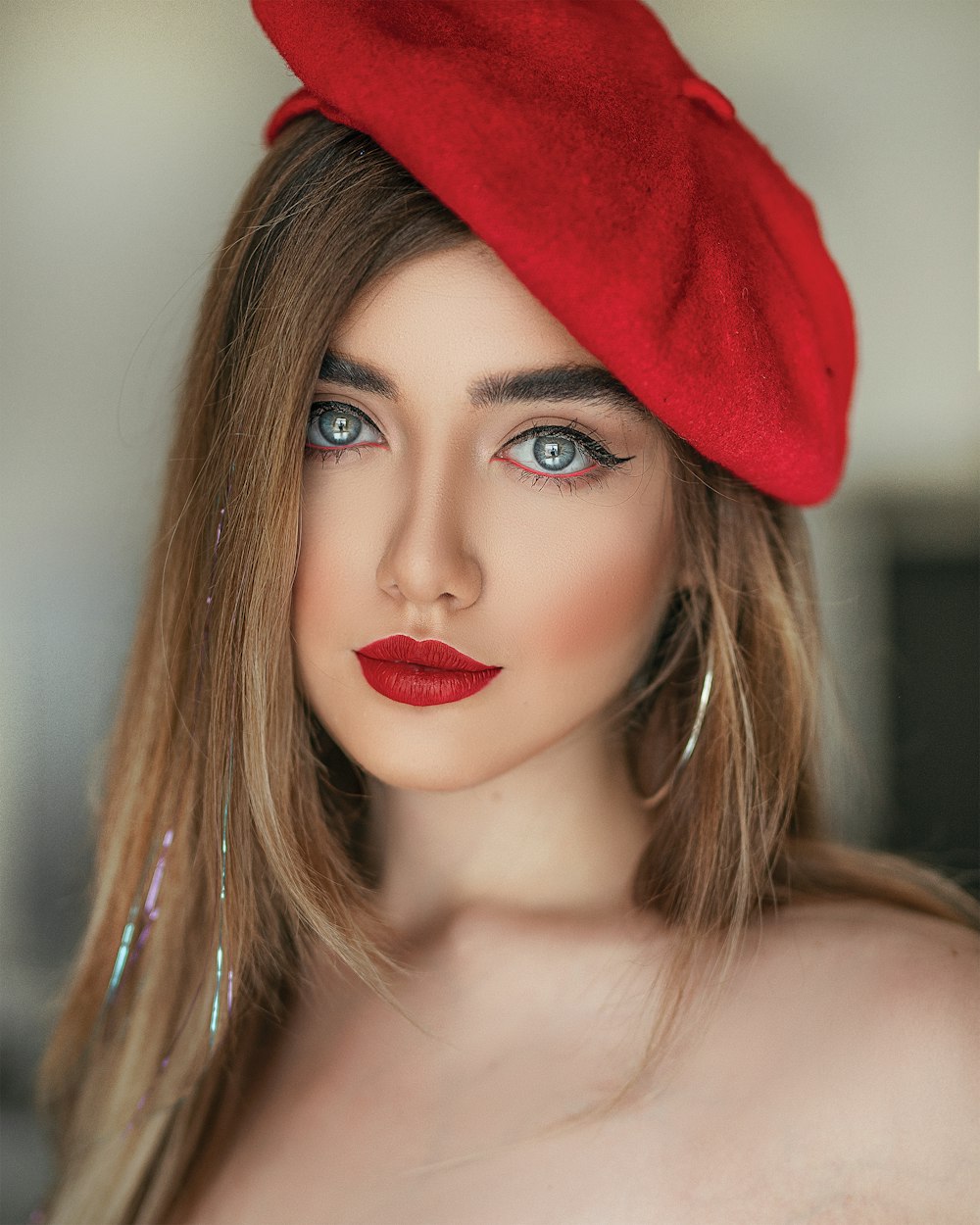 woman wearing red flat cap