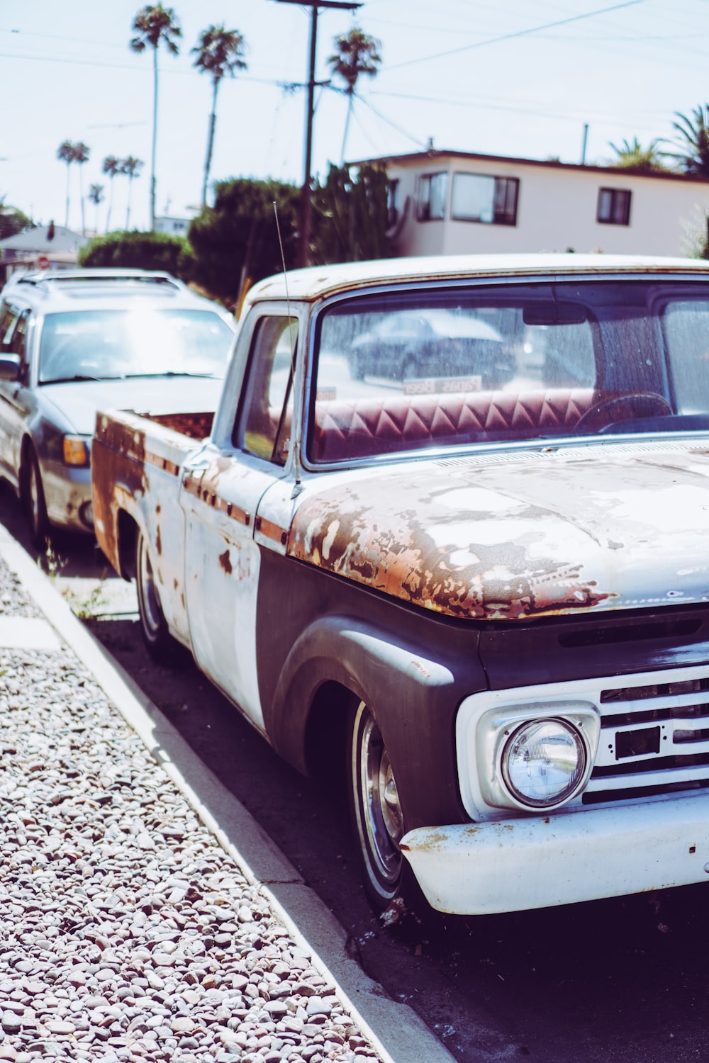 white crew cab pickup truck on road