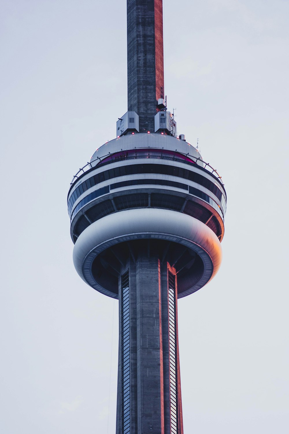 a very tall tower with a clock on it's side