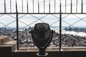 a coin operated parking meter on top of a building