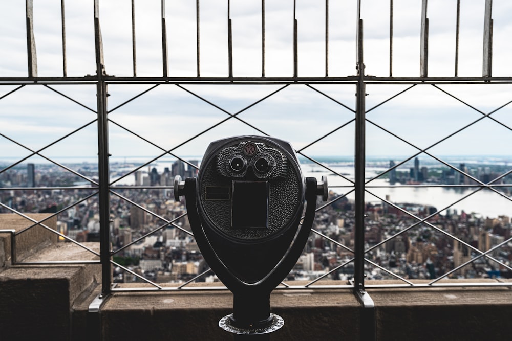 a coin operated parking meter on top of a building