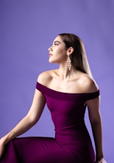 woman wearing purple off-shoulder dress