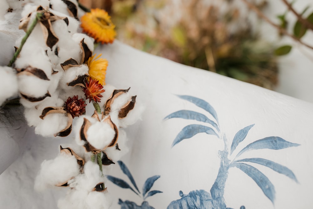 white flowers on white textile