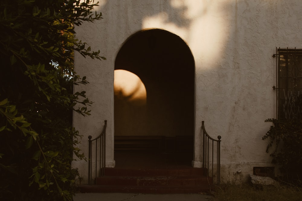 a white building with a door and a window