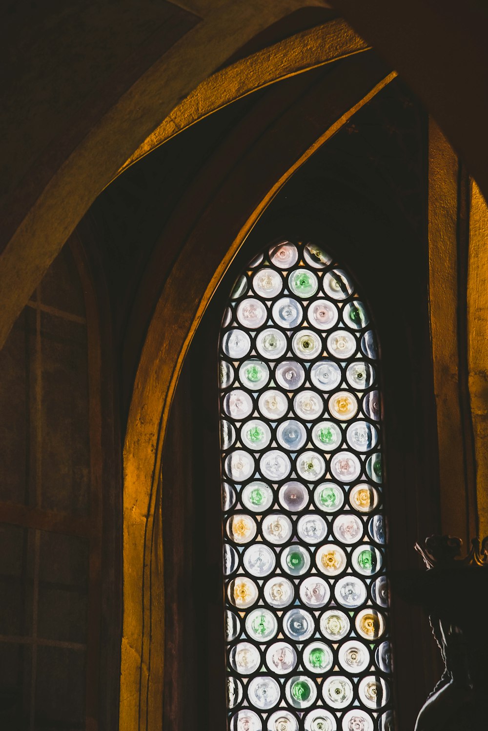 a large stained glass window in a church