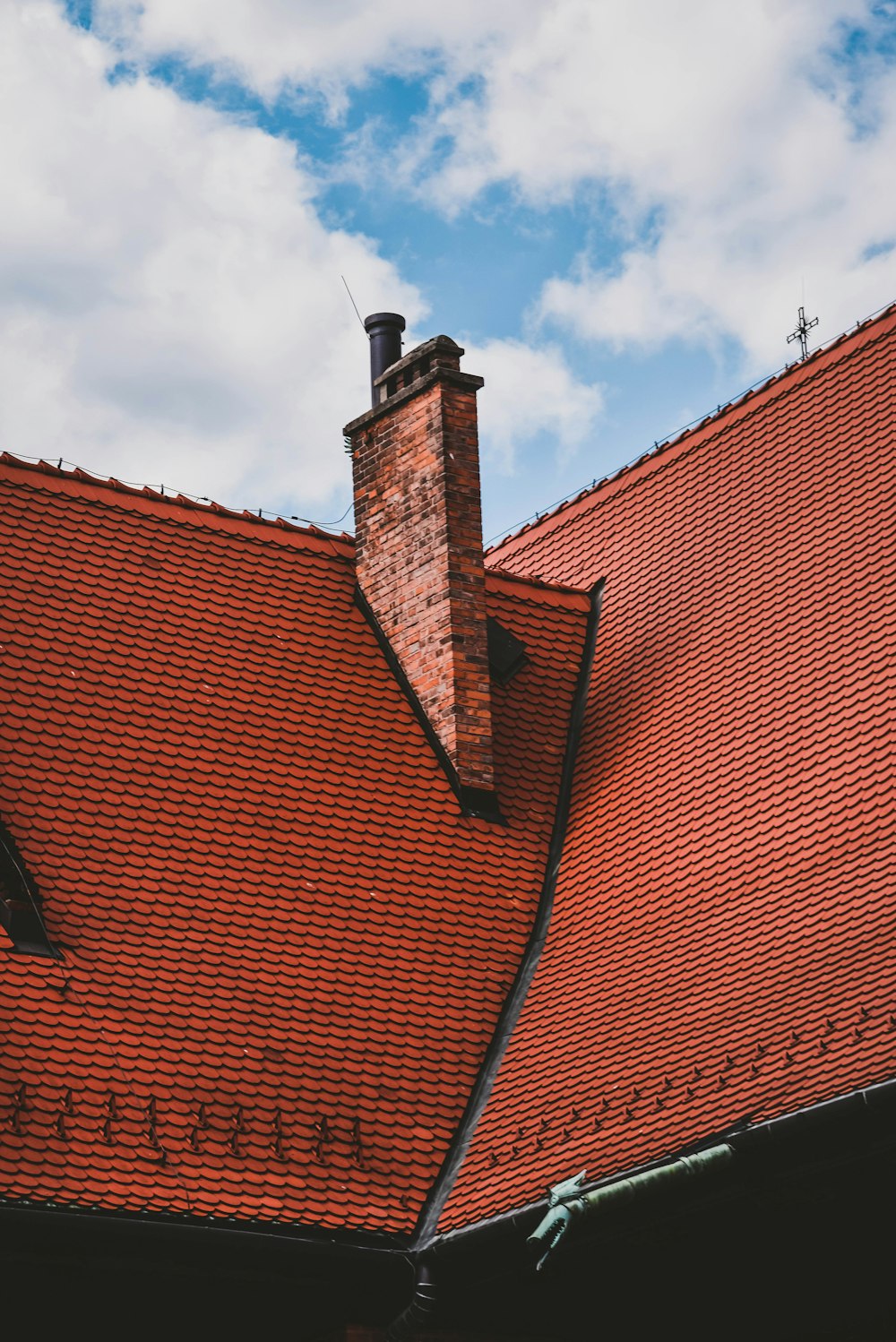 orange roof view under blue and white skies