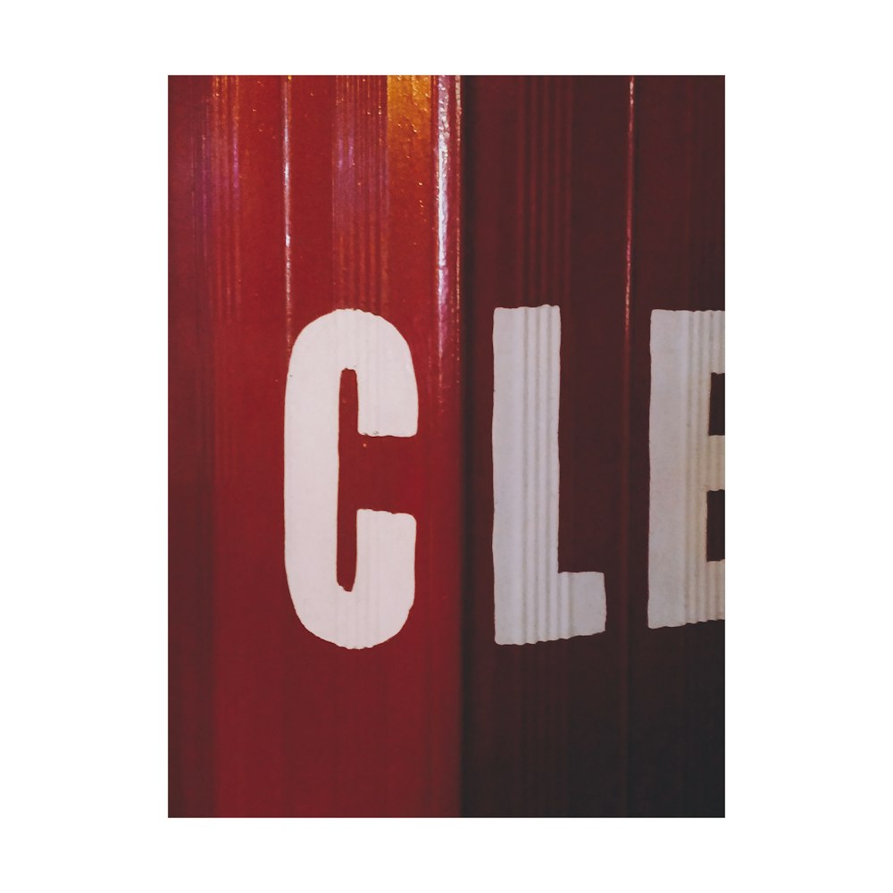 a close up of a red door with the word cll painted on it
