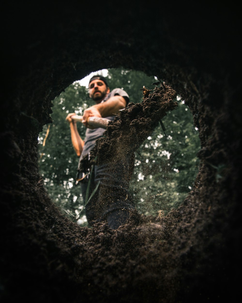 man standing near hole