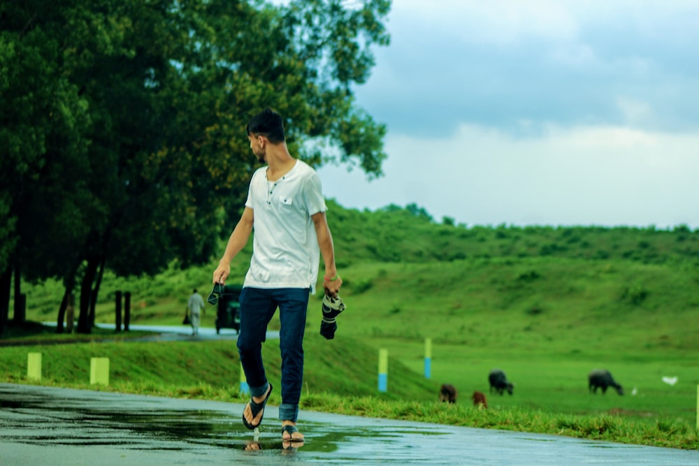 men's white crew-neck t-shirt and blue denim jeans