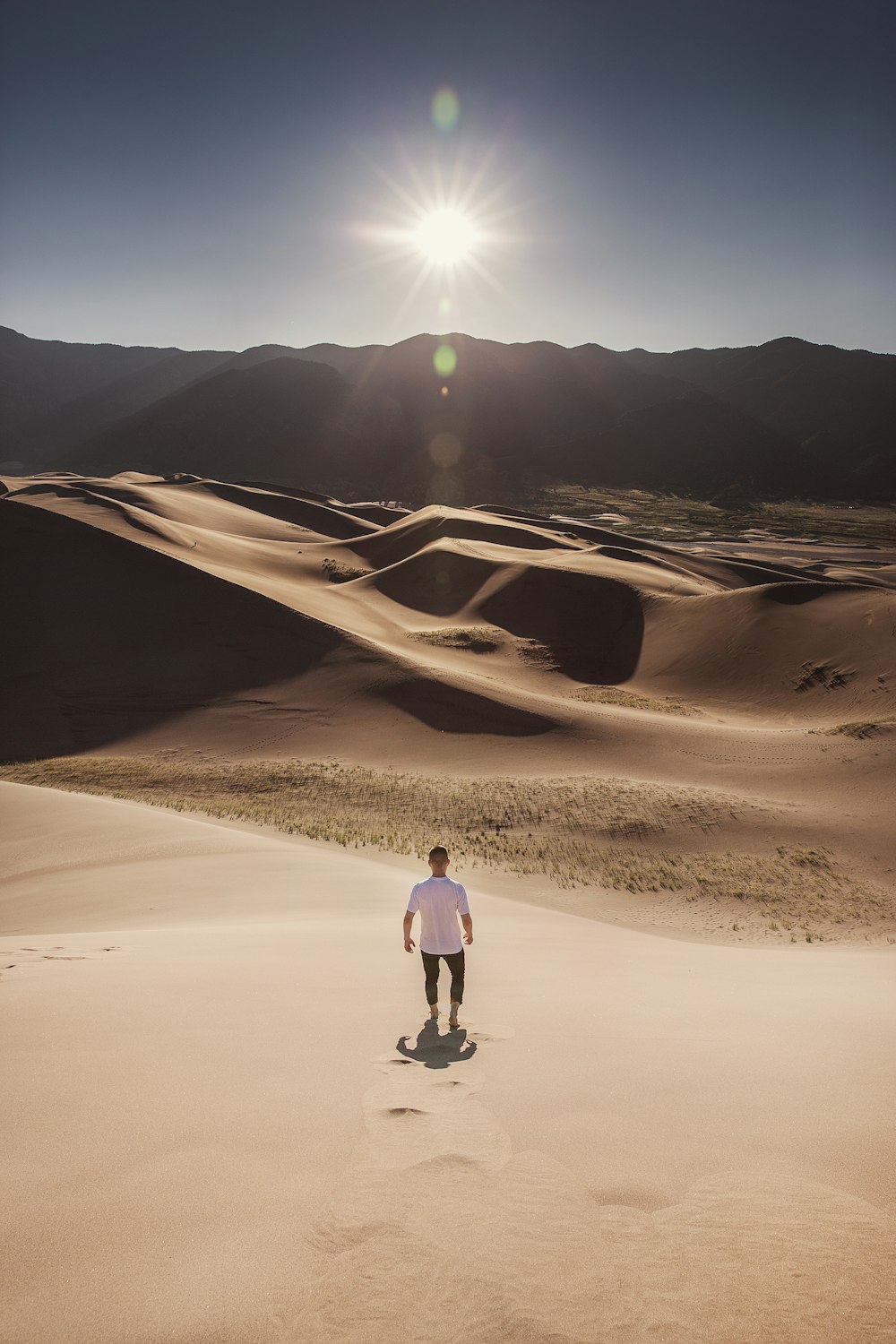 man standing on desert