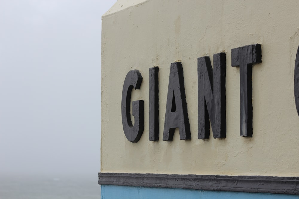 a sign on the side of a building that says giant