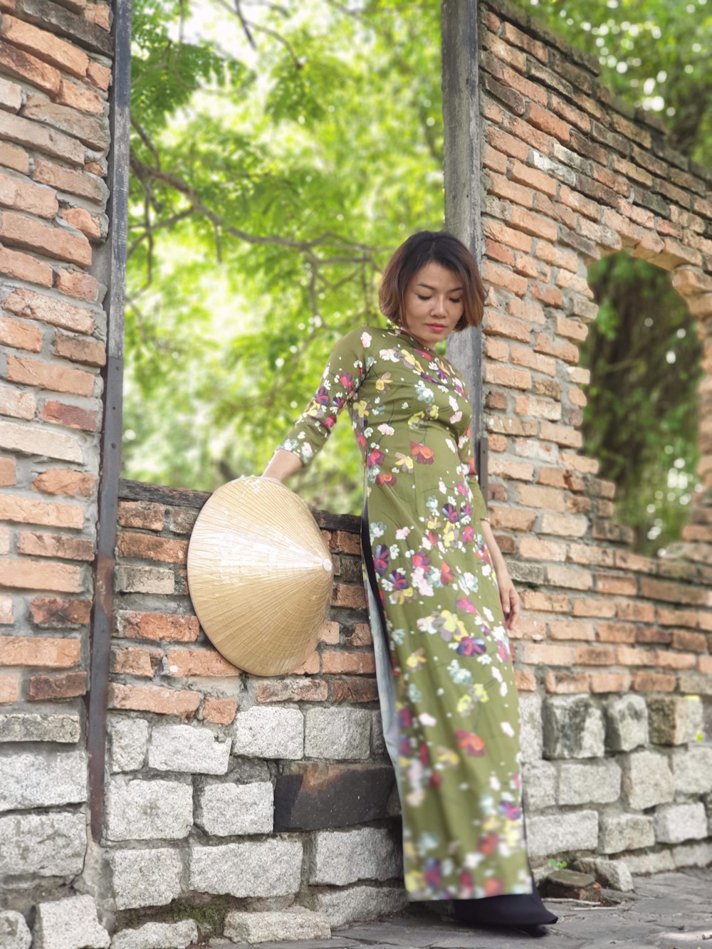 woman leans on wall