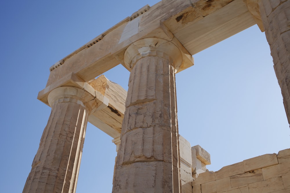 low-angle photography of beige column