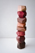 Close-up of colorful, square-shaped wooden blocks stacked precisely.