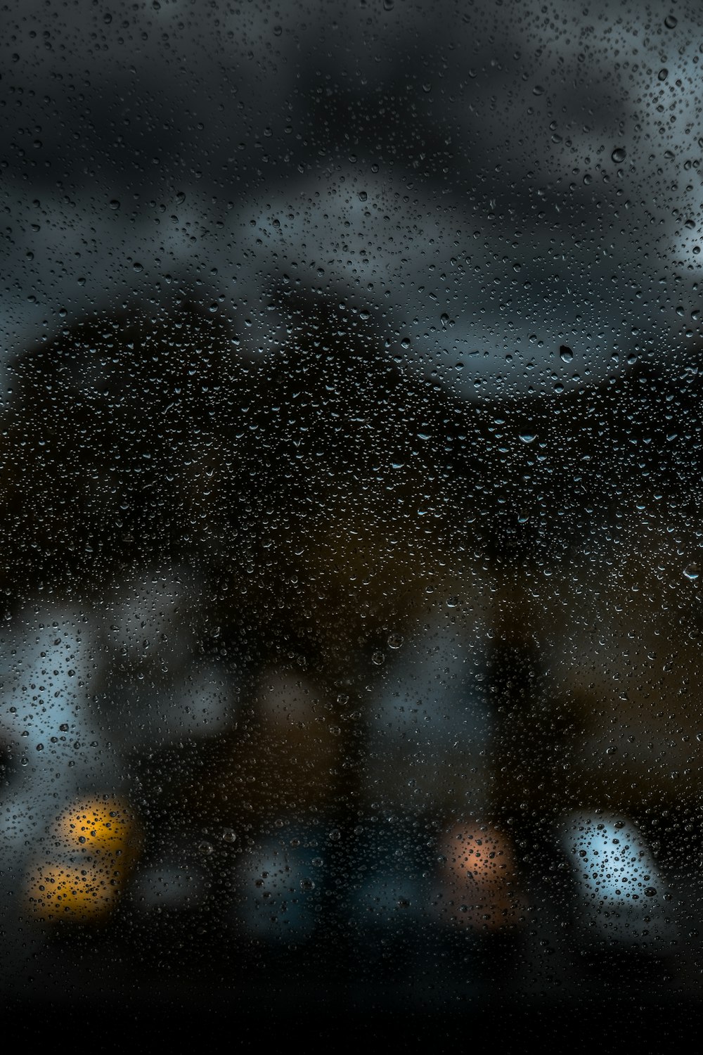 rain drops on a window with a blurry background