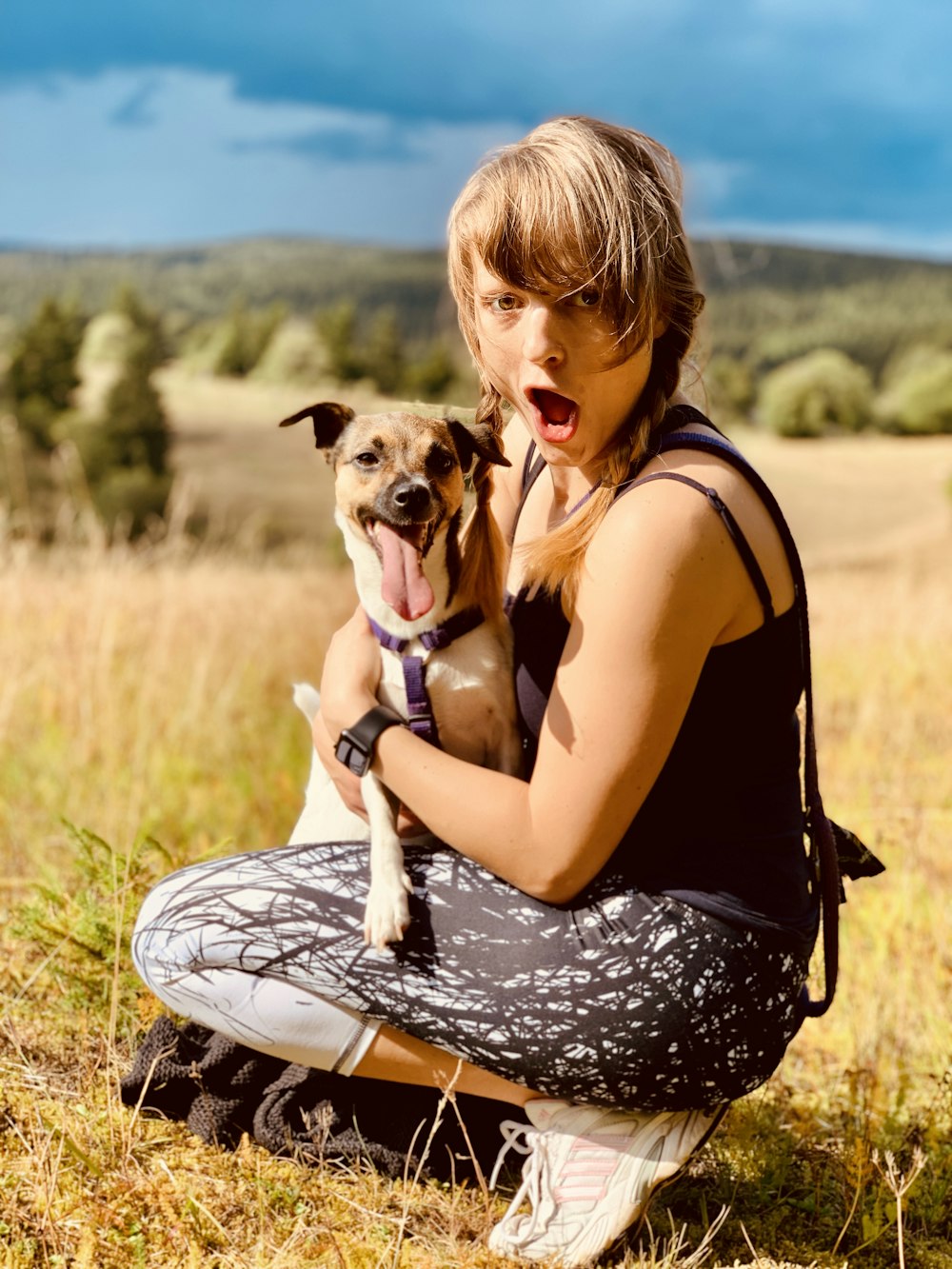 woman holding dog