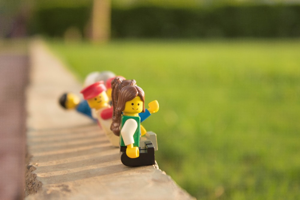 photo of LEGO sitting on concrete edge