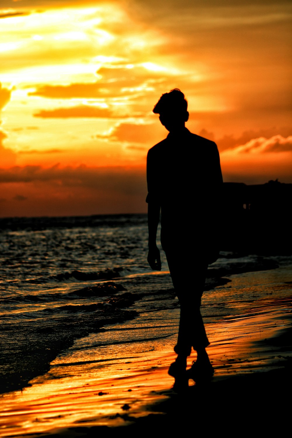 silhouette of man on shore