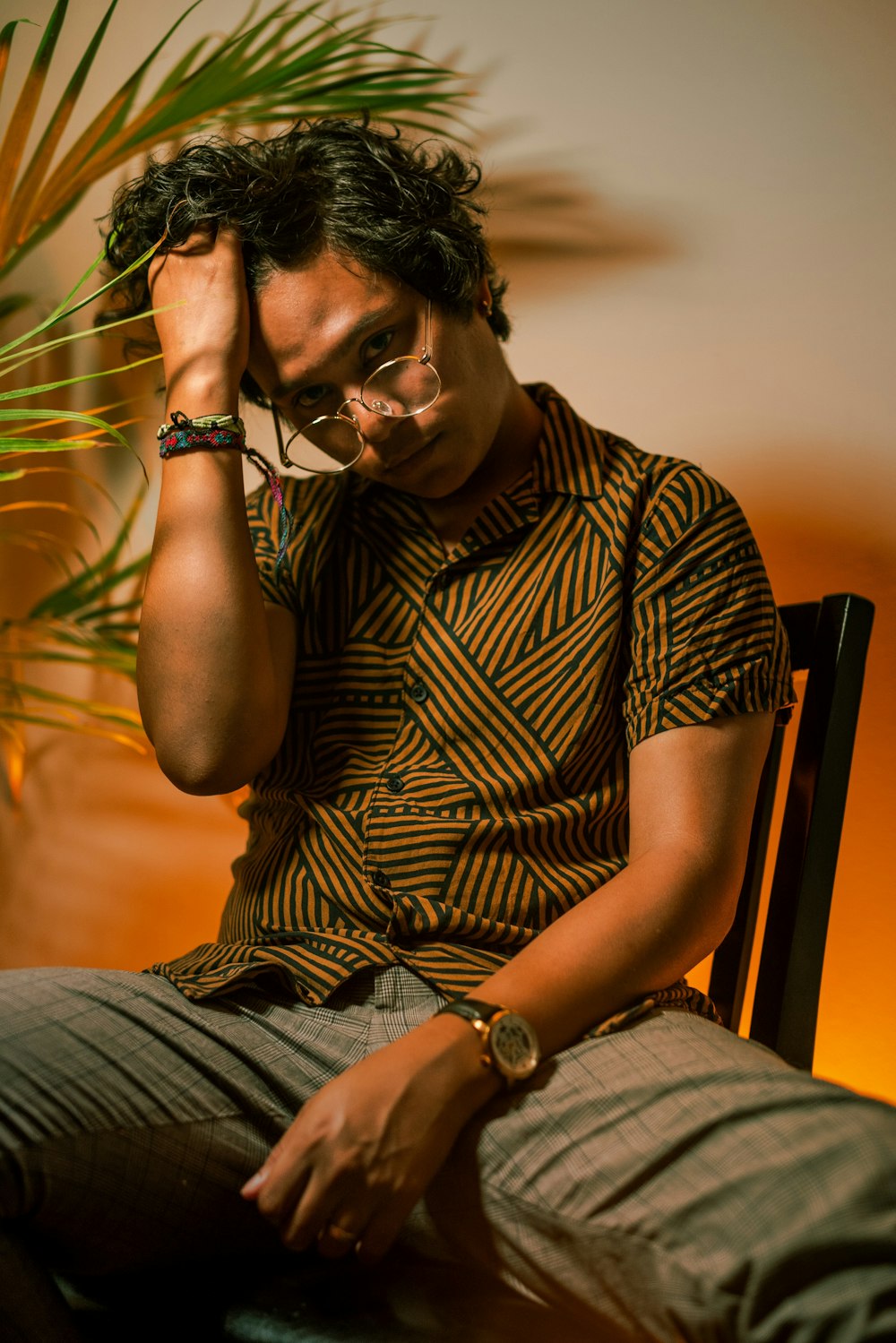 man sitting on brown chair