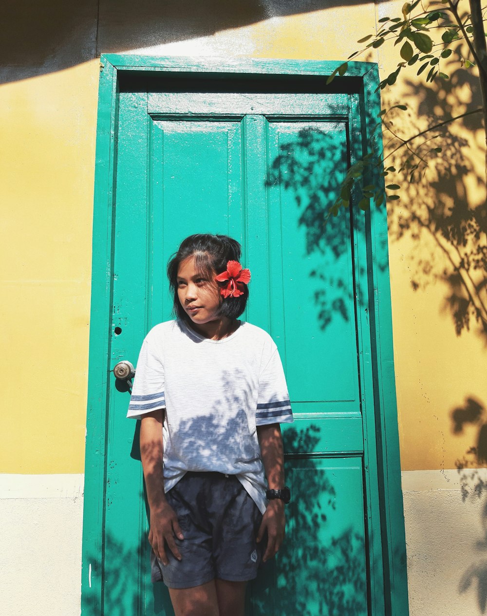 woman standing in front of wooden door