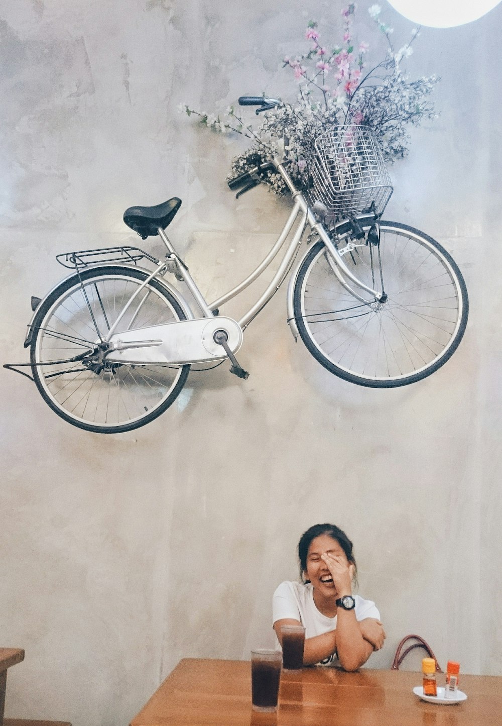 woman sits near table