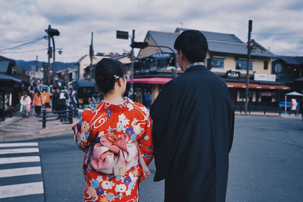 man and woman near pedestrian lane