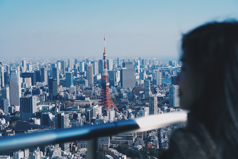 woman watching city building