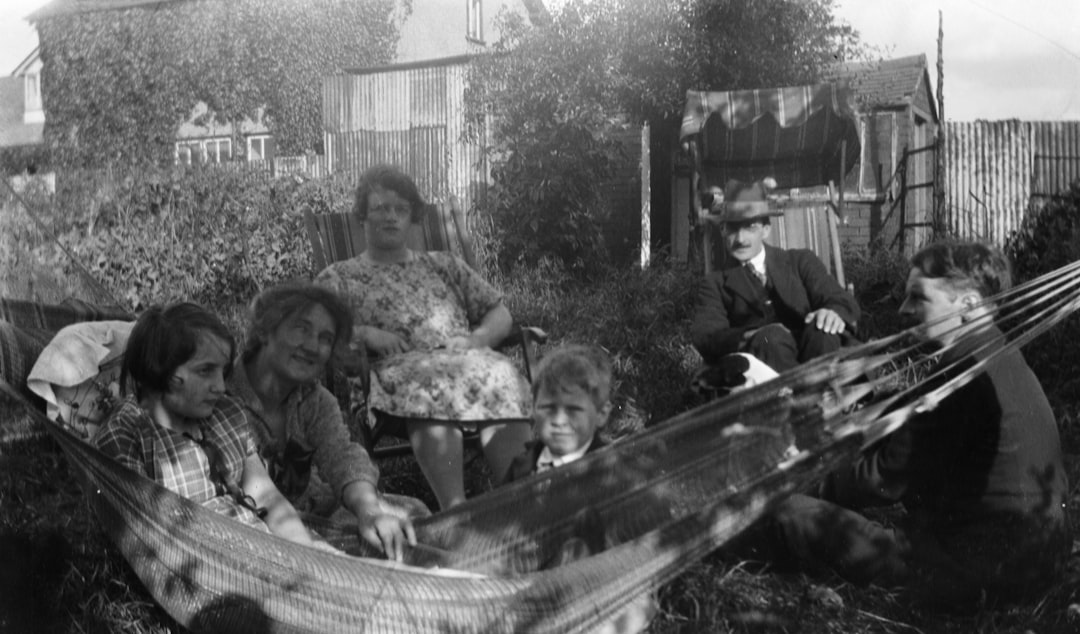 gray-scale photo of person in hammock