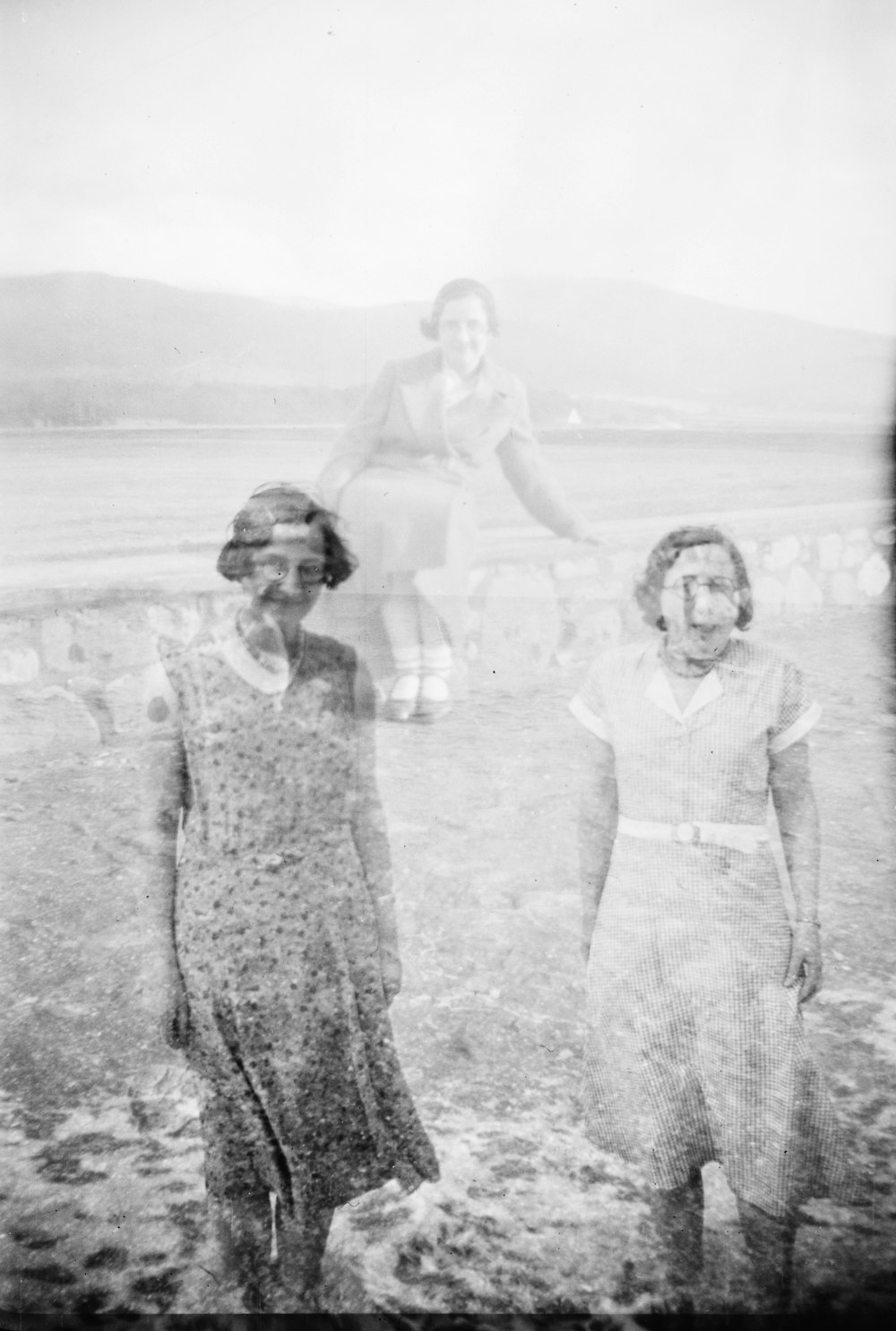 grayscale photo of three women