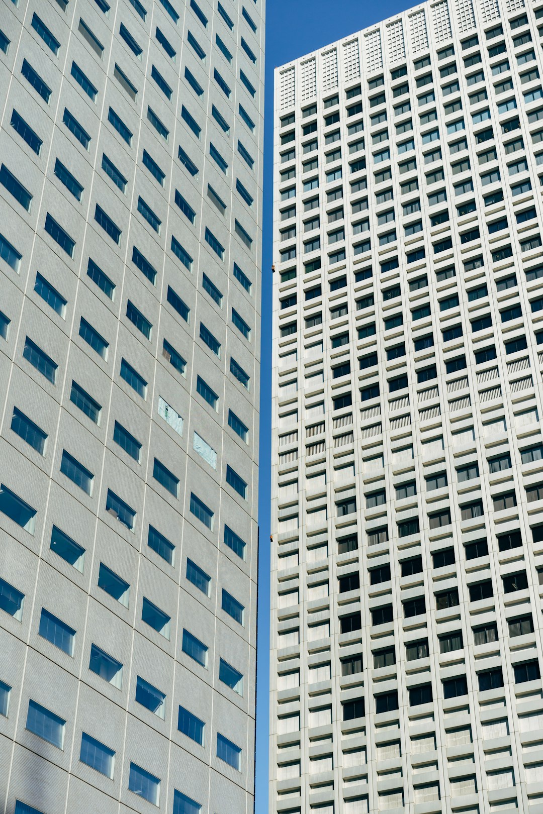 two white high-rise buildings