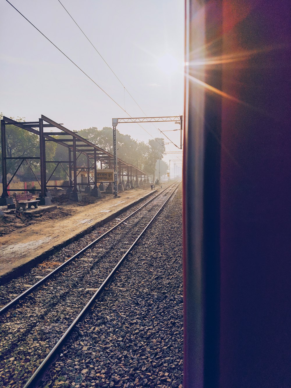 gray train tracks during daytime