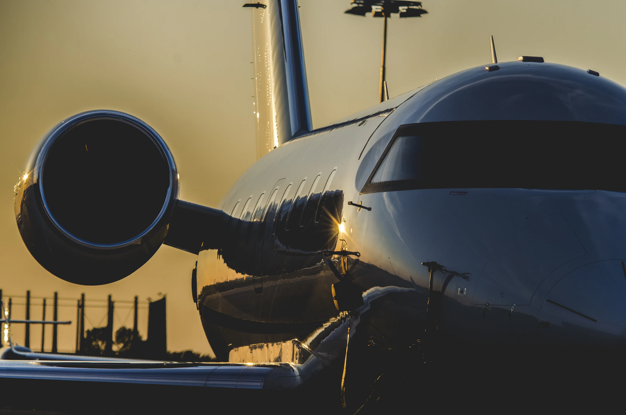 Private jet on the ramp at sunset