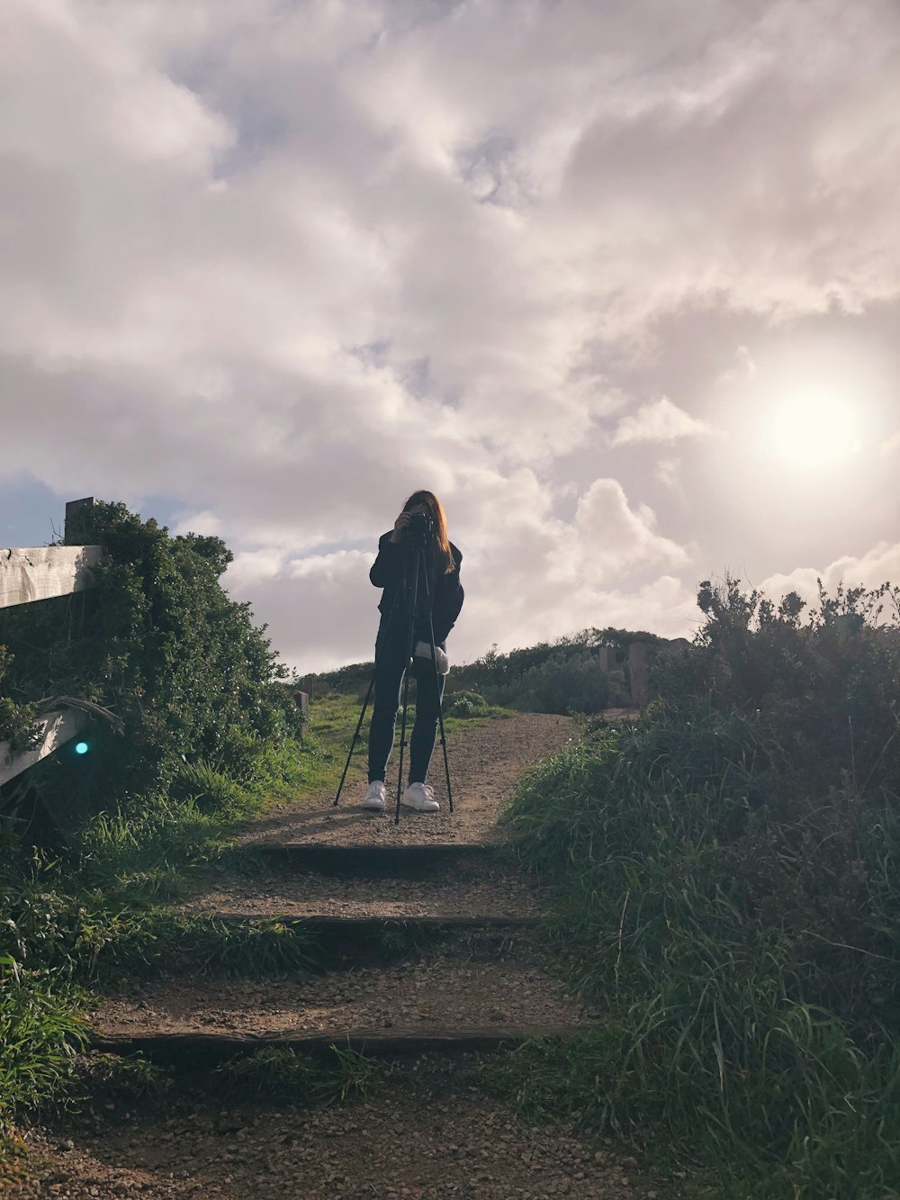 woman standing on pathway