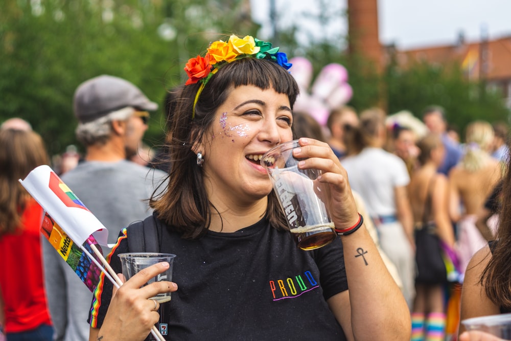 smiling woman holding drinking glass