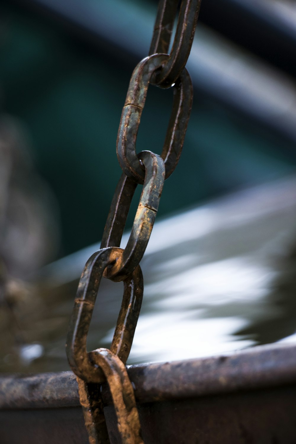 a chain is attached to a boat in the water