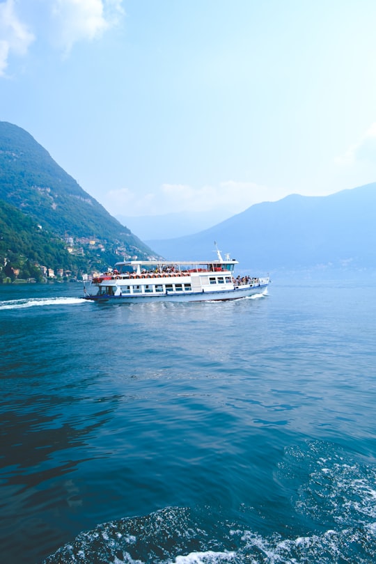 white and red boat in Lake Como Italy